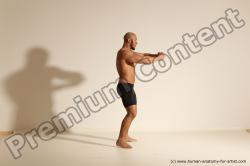 Underwear Gymnastic poses Man Black Muscular Bald Dancing Dynamic poses Academic